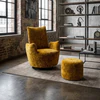 Bullfrog Blobb 1008 Schaukelsessel mit Hocker als goldgelber Highlightsessel in moderner Industrial-Wohnumgebung mit Loftfenstern und schwarzem Gestell