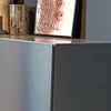 Modernes Kettnaker CASE Highboard als Ausstellungsstück mit  graublauem Rahmen und Front aus Schwarzstahl